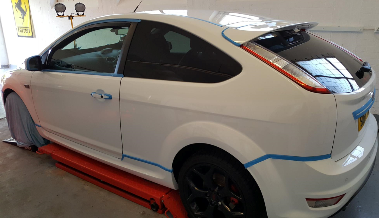 Car taped up ready for a full paintwork correction